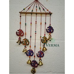 Om Wind chime on wooden bar